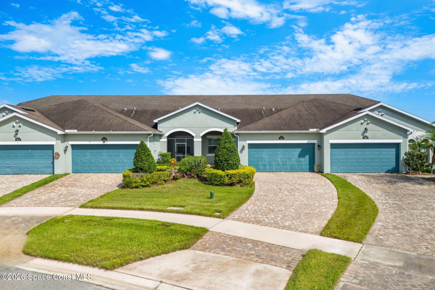 Front of the townhome with paver driveway