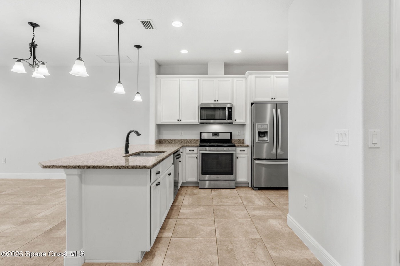 Kitchen with island and stainless appliances